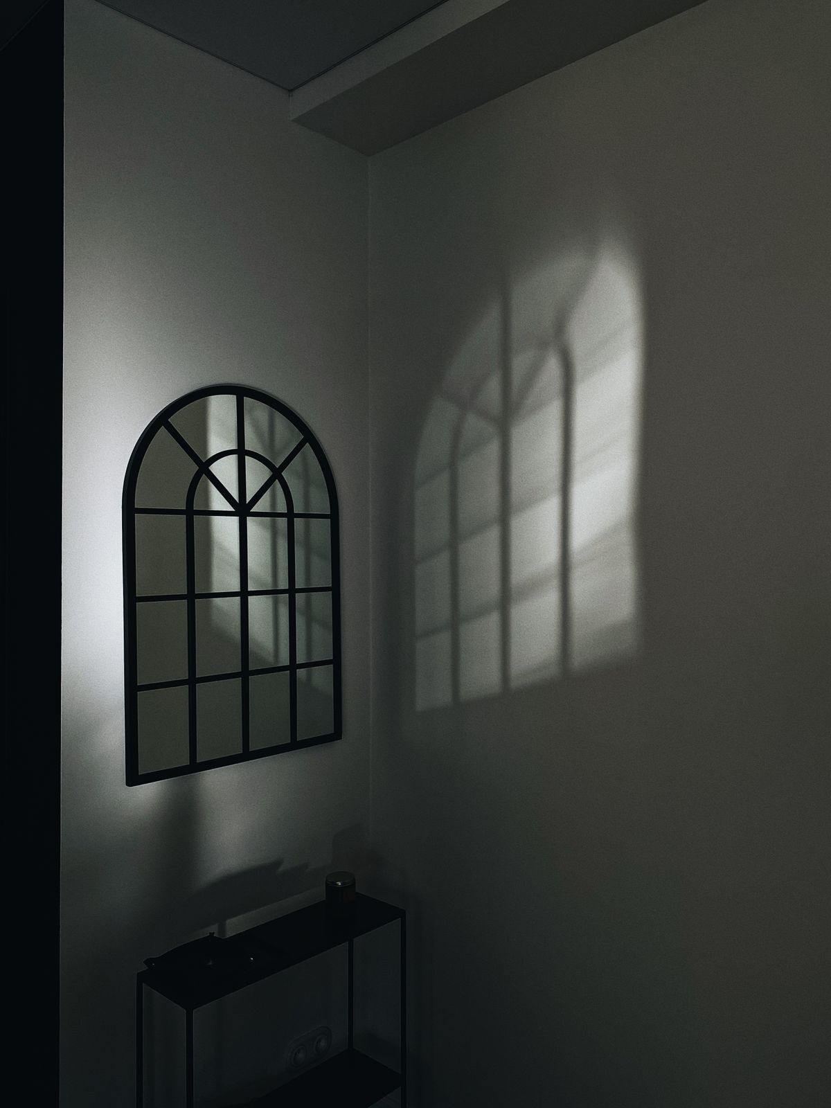 Window light reflected in a mirror