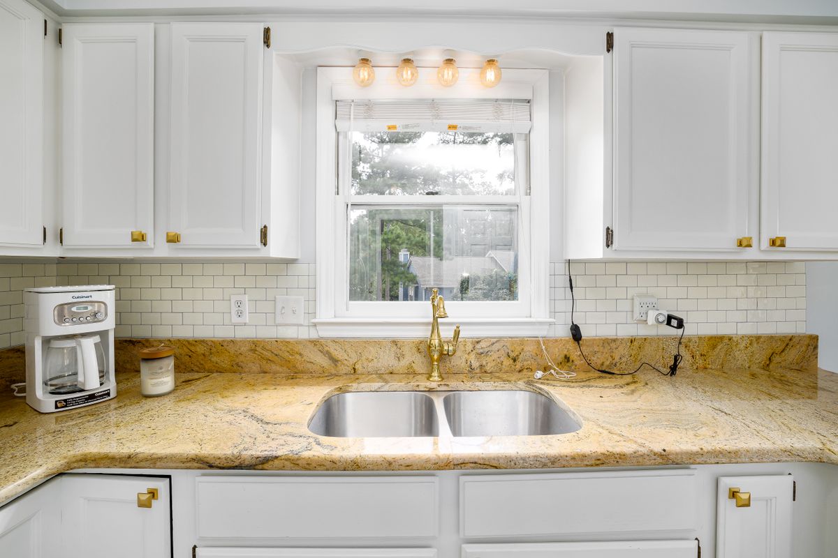 Stone countertop beside a sink
