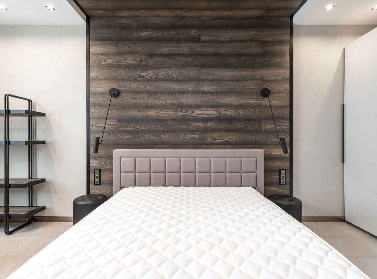 Uncovered mattress on a bed
