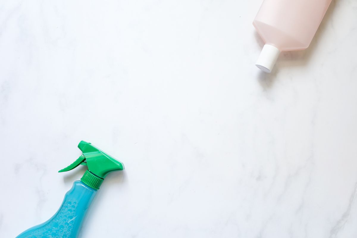 Two separate cleaning product containers