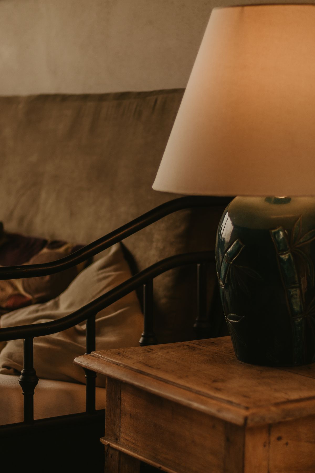 Shaded lamp on a wooden table
