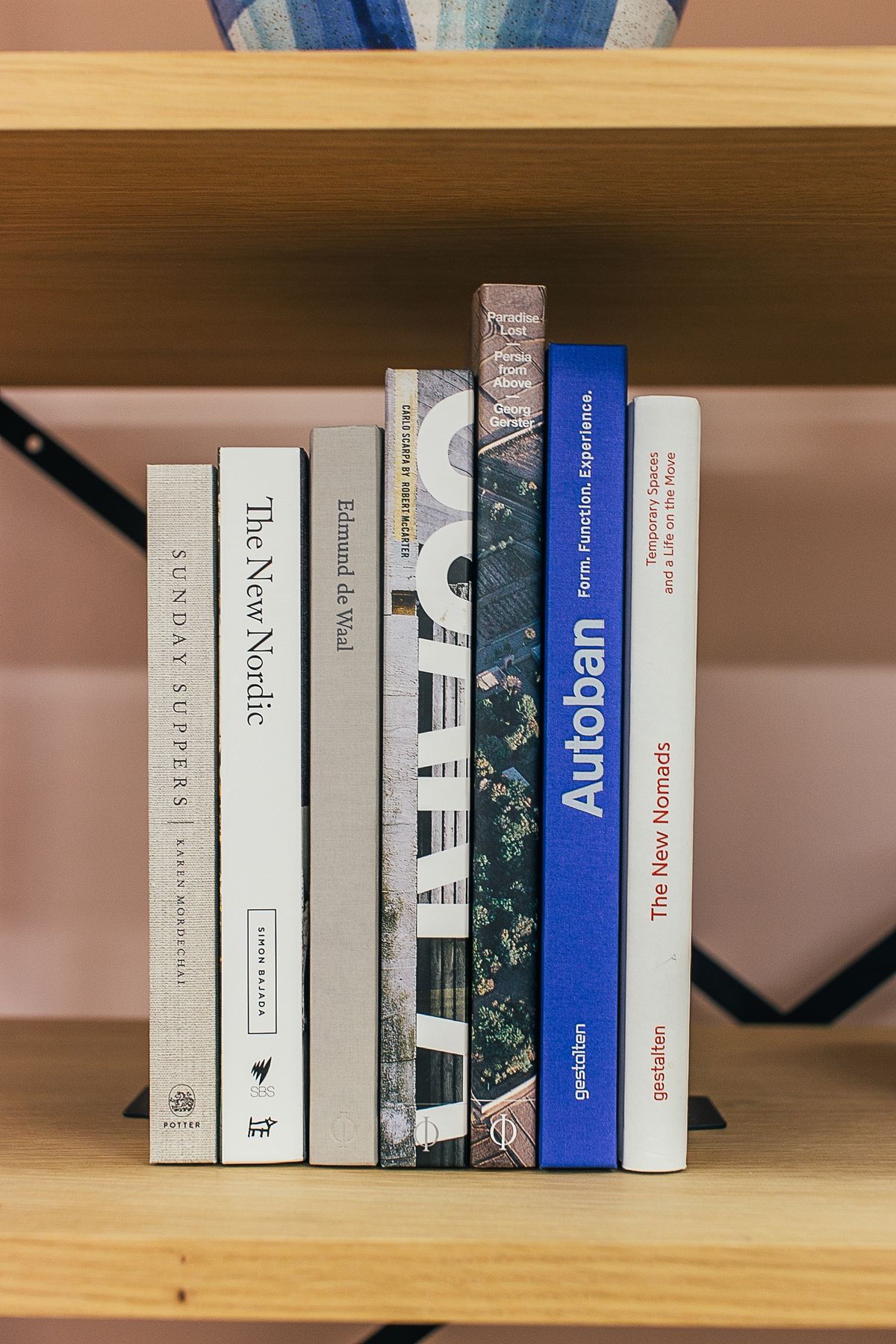 Books standing on a wooden shelf
